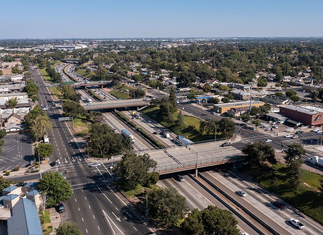Modesto, CA - Afternoon Aerial View of the 99 Freeway and Urban Downtown Core of Modesto, California